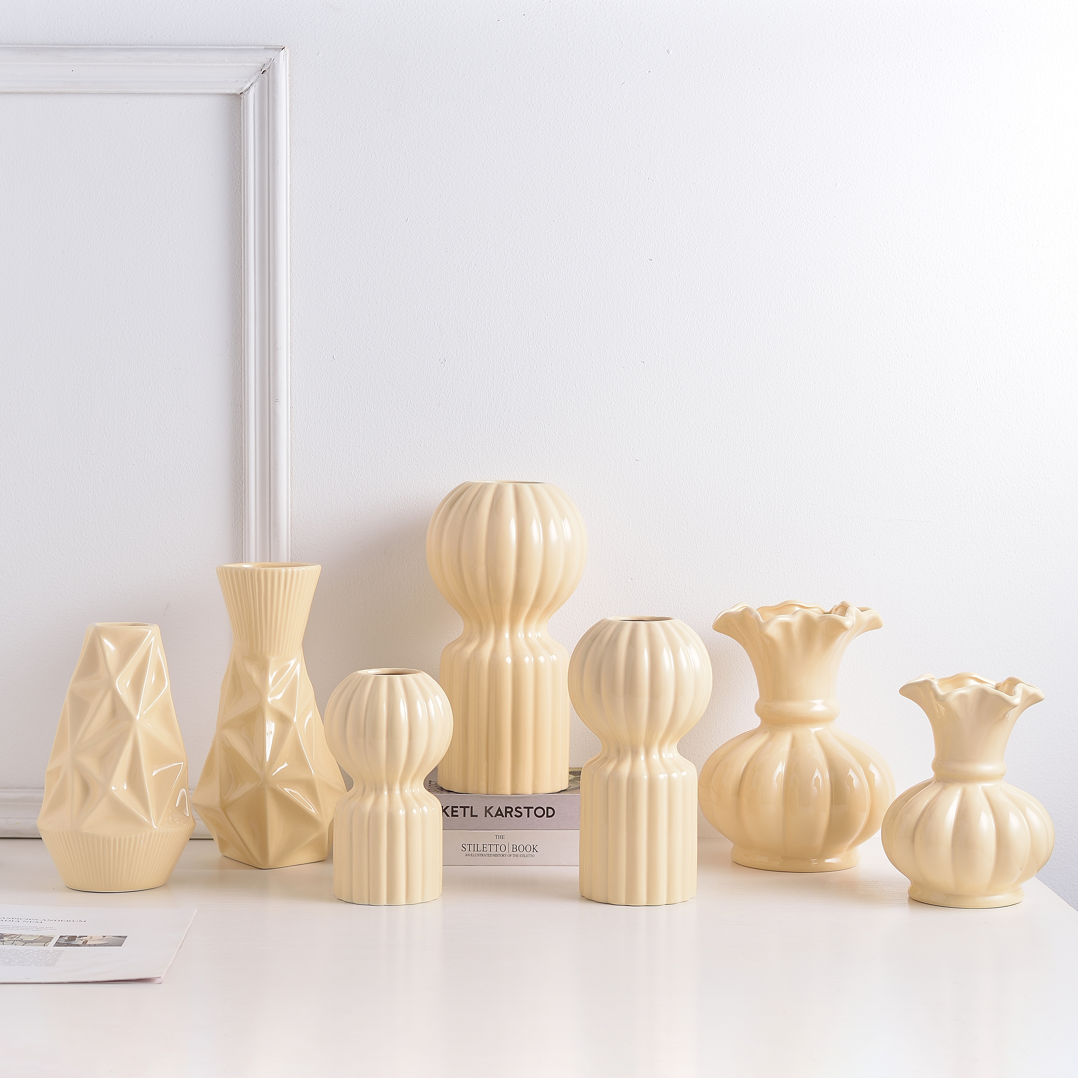 Cream sculptural ceramic vessels styled for boutique display