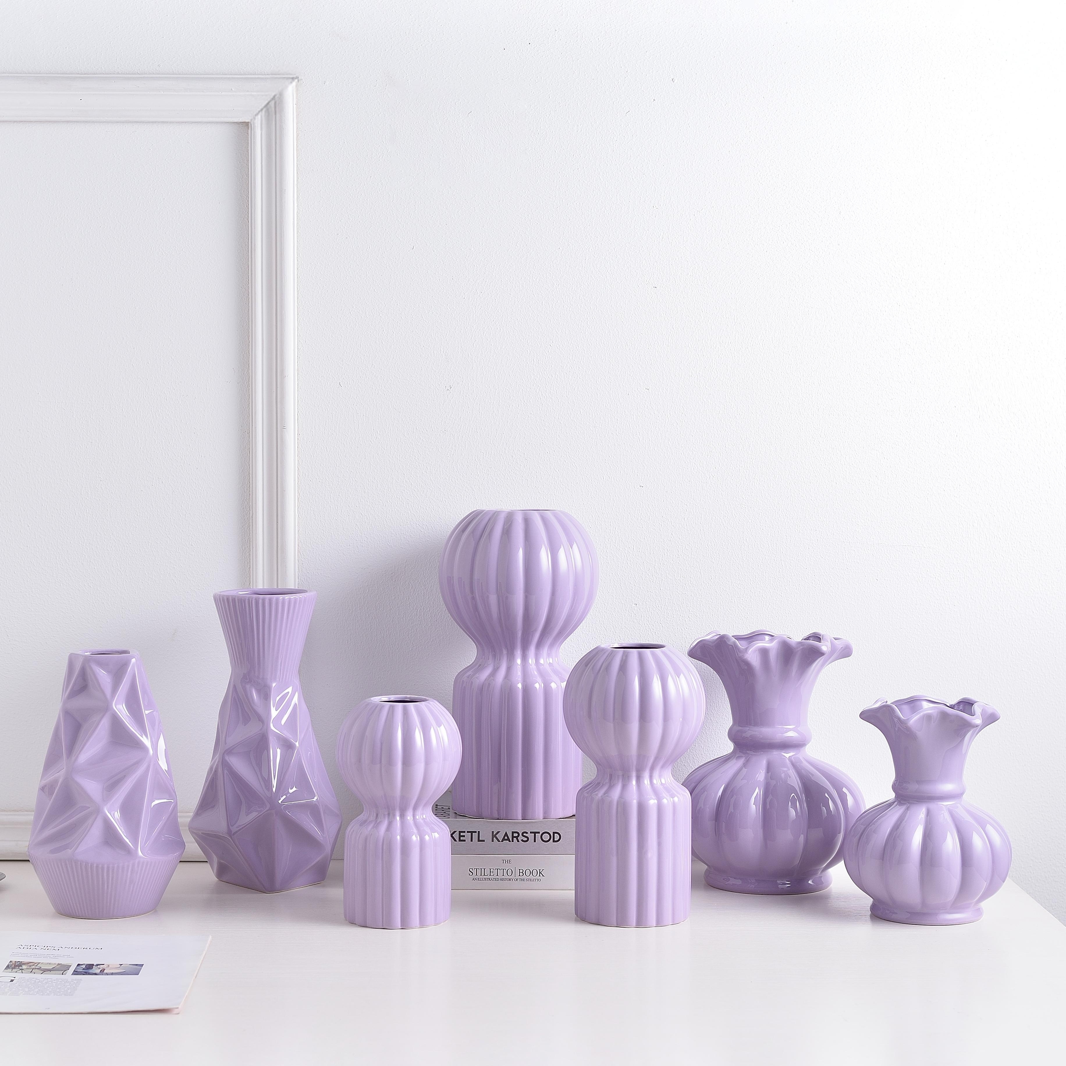 Ceramic vessels styled together in a soft boutique setting